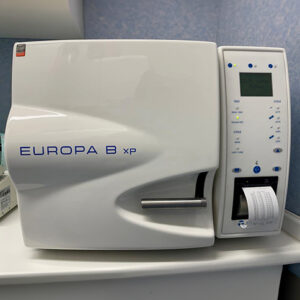 a white machine for sterilization with a screen and a button